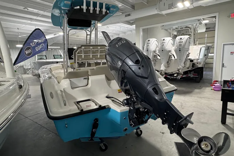 Slide: The Image of 2026 Key West 219 FS boat with powerful outboard motor in showroom. - 3