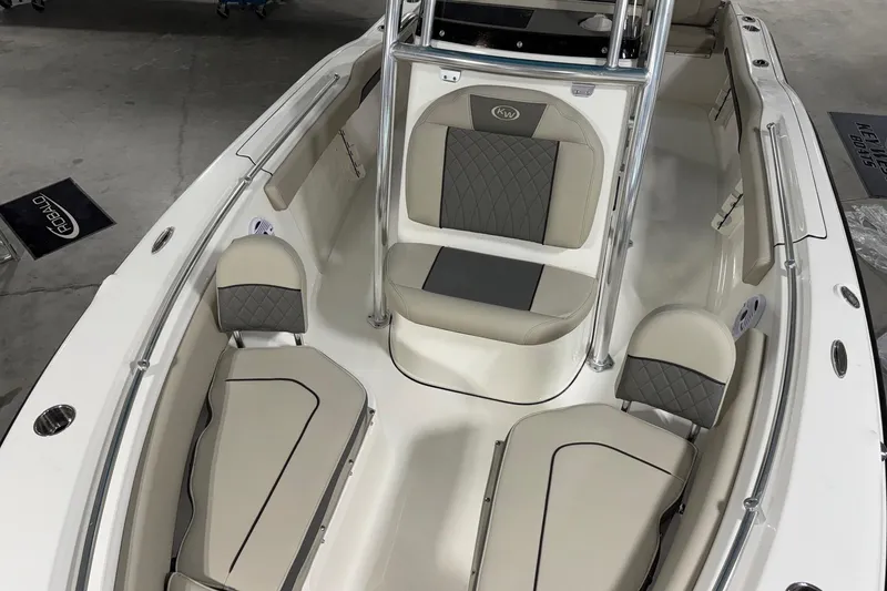 Slide: The Image of 2026 Key West 219 FS boat interior with beige seating and sleek design. - 8