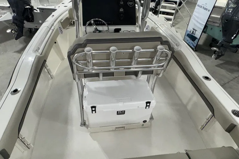 Slide: The Image of 2026 Key West 219 FS boat interior with seating and storage features. - 22