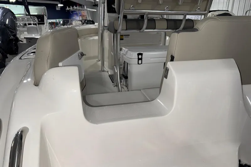 Slide: The Image of 2026 Key West 219 FS boat interior with seating and storage area. - 6