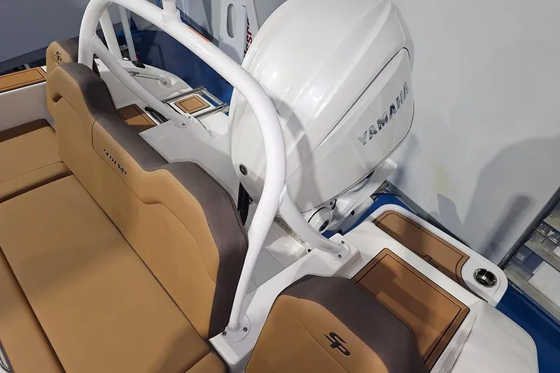 Slide: The Image of 2026 Sea Pro 245FLX Sandbar boat interior with Yamaha engine and tan seating. - 11