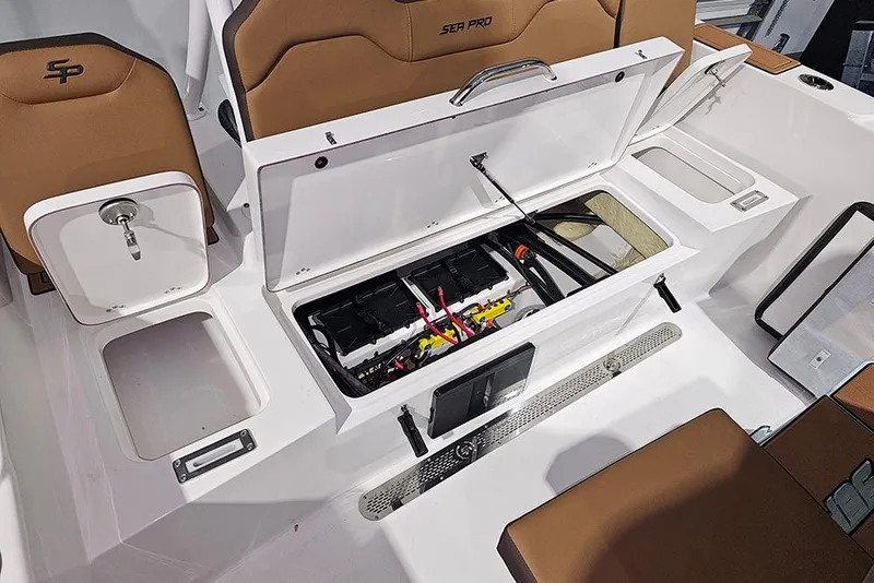 Slide: The Image of 2026 Sea Pro 245FLX Sandbar boat interior with open storage compartments and seating. - 13