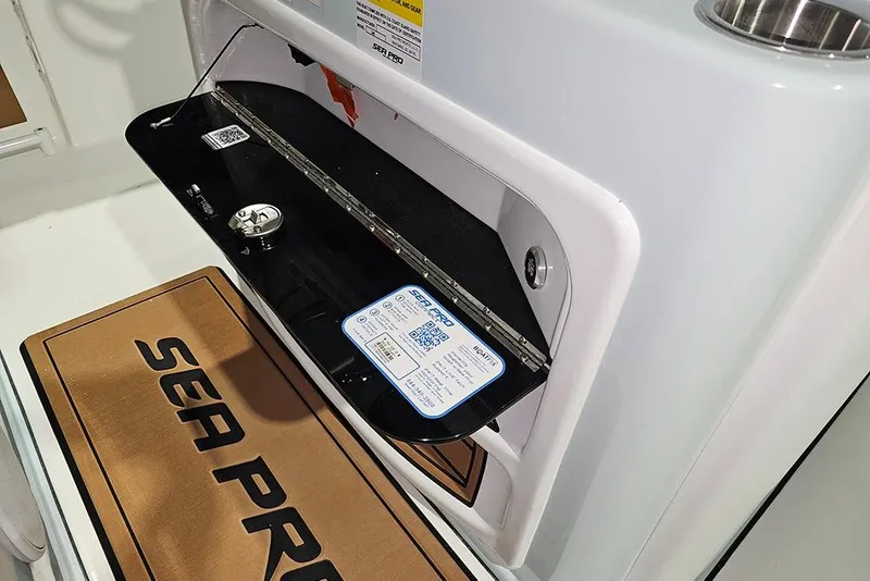 Slide: The Image of 2026 Sea Pro 245FLX Sandbar boat compartment with QR code and branded mat. - 20