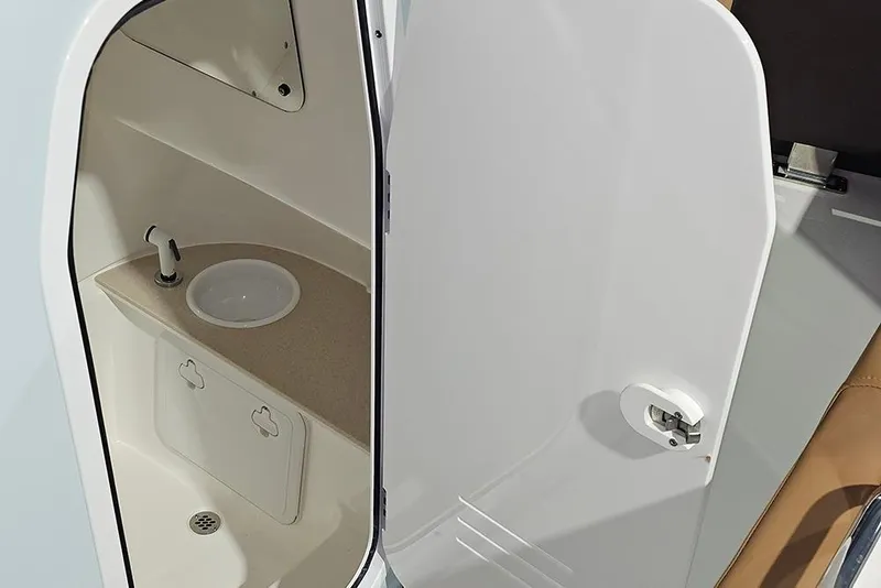 Slide: The Image of 2026 Sea Pro 245FLX Sandbar boat interior with sink and storage compartment. - 25