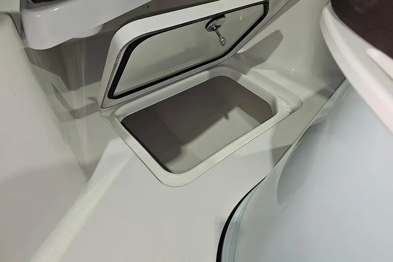 Slide: The Image of Storage compartment on 2026 Sea Pro 245FLX Sandbar boat, featuring secure latch and sleek design. - 31