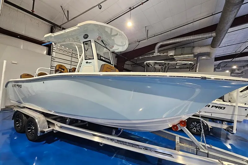Slide: The Image of 2026 Sea Pro 245FLX Sandbar boat on trailer in showroom, side view. - 4