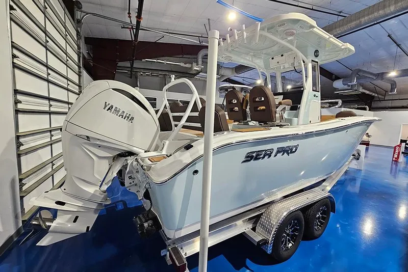 Slide: The Image of 2026 Sea Pro 245FLX Sandbar boat with Yamaha engine in showroom. - 5