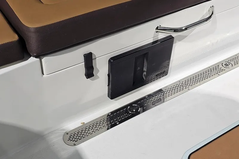 Slide: The Image of 2026 Sea Pro 245FLX Sandbar boat interior with brown seating and storage compartment. - 8