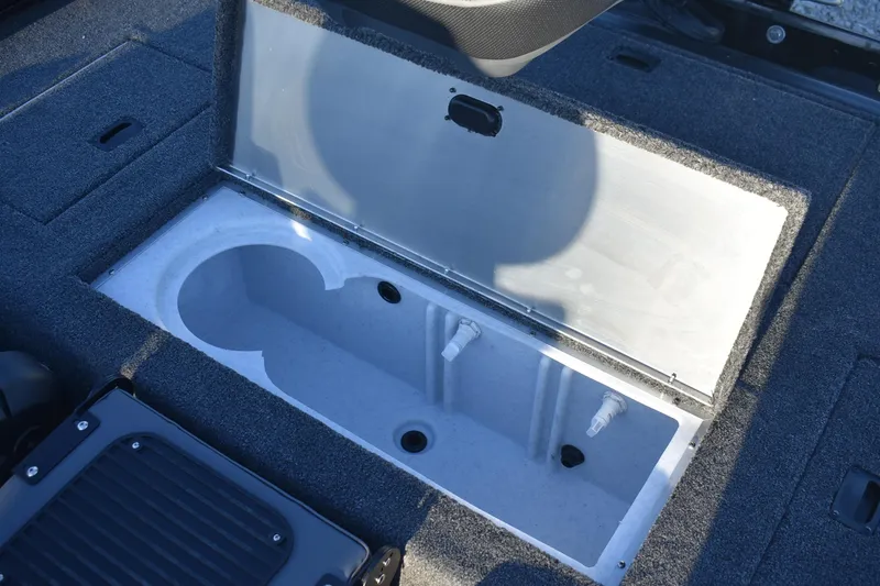 Slide: The Image of 2026 Lowe Stinger 175C boat livewell with open lid, showcasing interior design. - 13