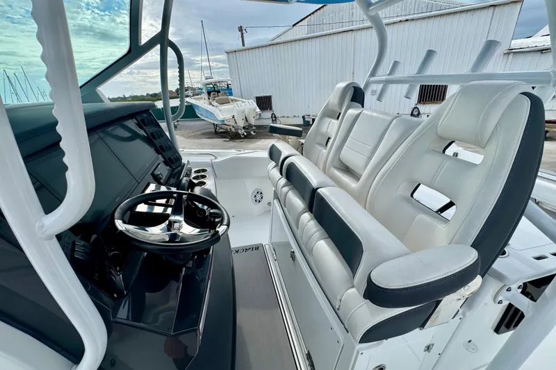 Slide: The Image of 2023 Blackfin 332 CC boat interior with modern helm and seating. - 101