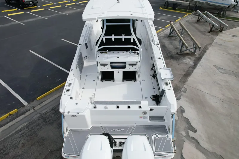 Slide: The Image of 2023 Blackfin 332 CC boat, aerial view of spacious deck and seating area. - 15