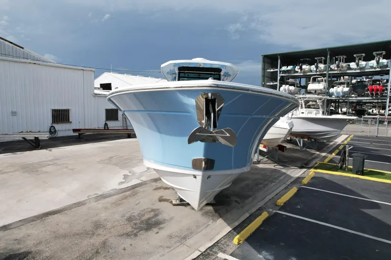 Slide: The Image of 2023 Blackfin 332 CC boat in a marina storage area. - 3