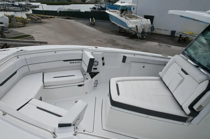 Slide: The Image of 2023 Blackfin 332 CC boat interior with white seating and modern design. - 32