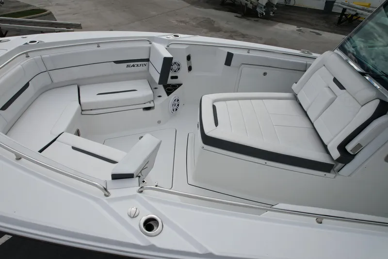 Slide: The Image of 2023 Blackfin 332 CC boat interior with white seating and modern design. - 33