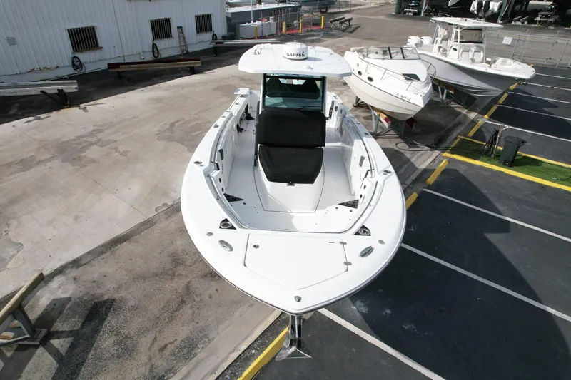 Slide: The Image of 2023 Blackfin 332 CC boat in a marina, aerial view. - 4