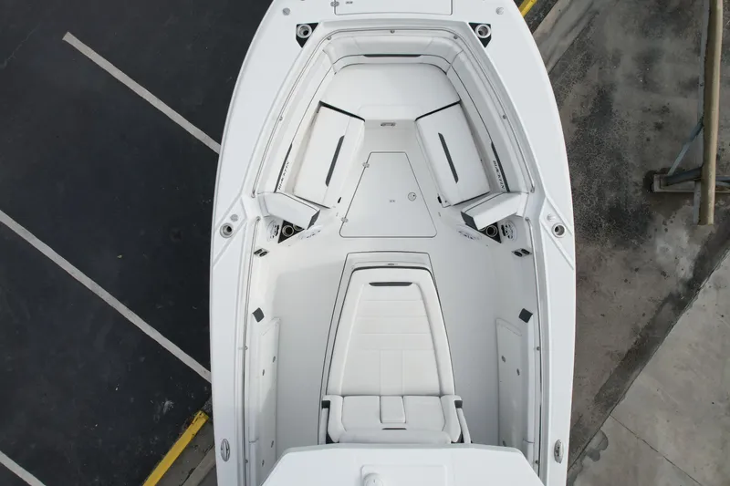 Slide: The Image of 2023 Blackfin 332 CC boat interior, aerial view, showcasing seating and storage layout. - 47
