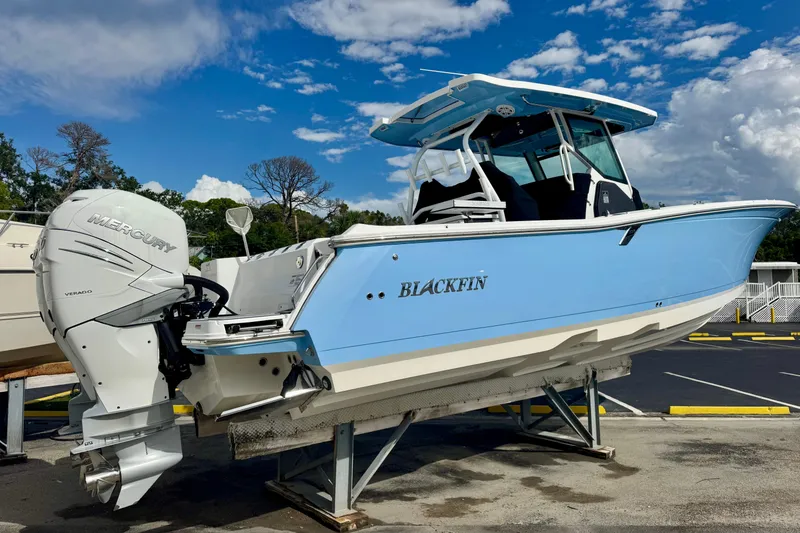 Slide: The Image of 2023 Blackfin 332 CC boat with Mercury Verado engine on display. - 56