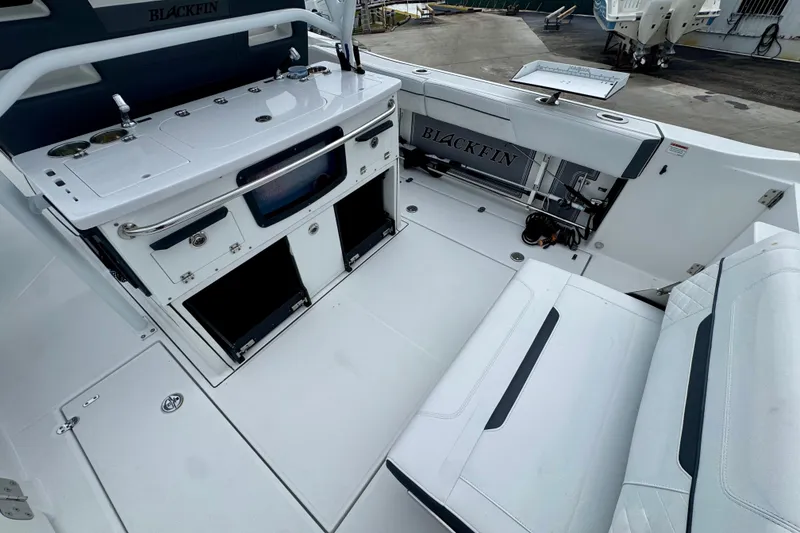 Slide: The Image of 2023 Blackfin 332 CC boat interior with seating and storage compartments. - 61