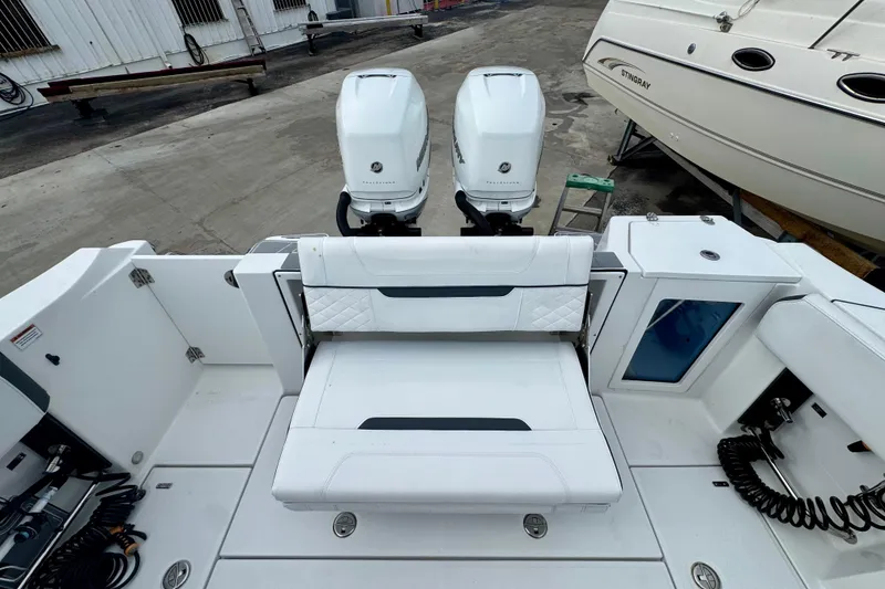 Slide: The Image of 2023 Blackfin 332 CC boat with dual engines and spacious seating area. - 69