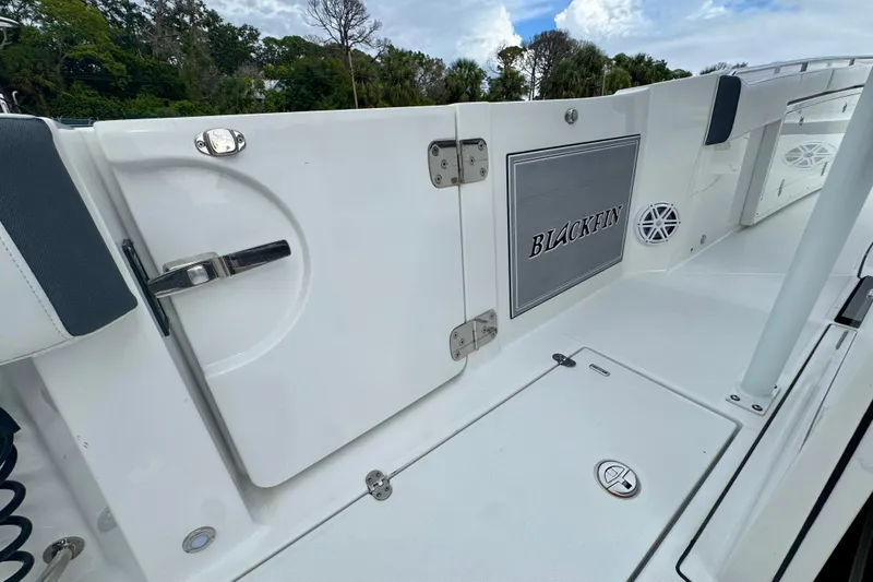 Slide: The Image of 2023 Blackfin 332 CC boat deck with sleek design and storage compartments. - 71