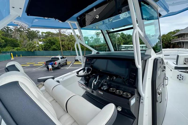 Slide: The Image of 2023 Blackfin 332 CC boat cockpit with modern controls and seating. - 78