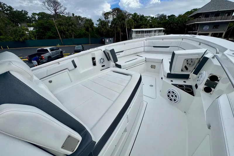 Slide: The Image of 2023 Blackfin 332 CC boat interior with white seating and speakers. - 84