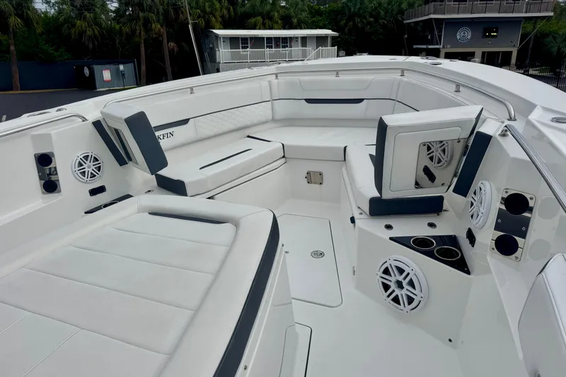 Slide: The Image of 2023 Blackfin 332 CC boat interior with white seating and built-in speakers. - 85