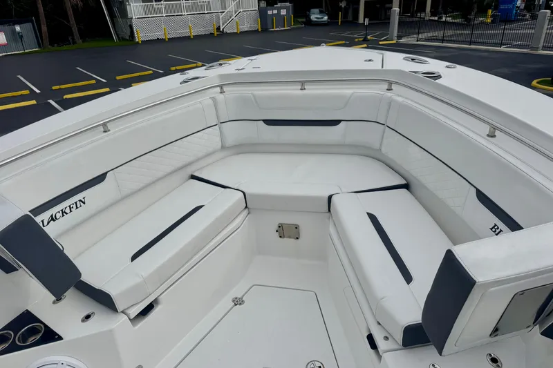Slide: The Image of 2023 Blackfin 332 CC boat with spacious white seating area. - 87