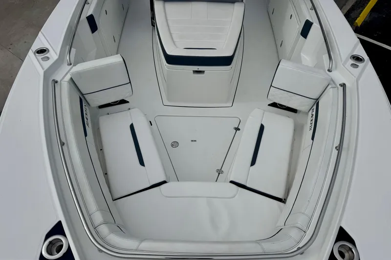 Slide: The Image of 2023 Blackfin 332 CC boat interior with white seating and storage compartments. - 88