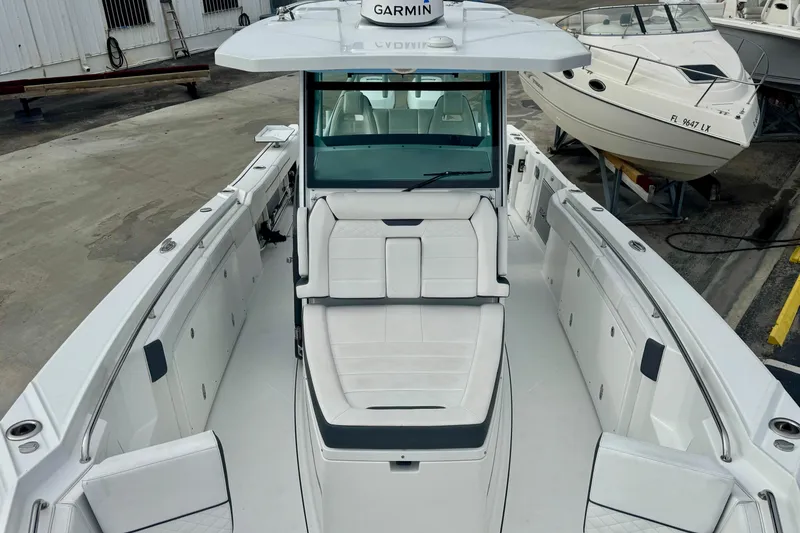 Slide: The Image of 2023 Blackfin 332 CC boat with spacious seating and modern design. - 90