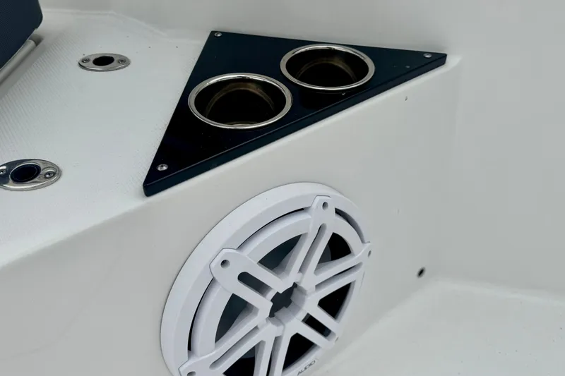 Slide: The Image of 2023 Blackfin 332 CC boat interior with cup holders and speaker. - 94