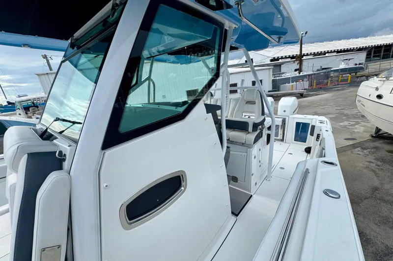 Slide: The Image of 2023 Blackfin 332 CC boat with sleek design and modern cockpit features. - 98