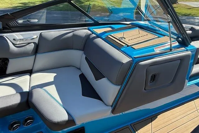 Slide: The Image of 2020 Moomba Makai boat interior with gray and blue seating, sleek design, and modern features. - 11