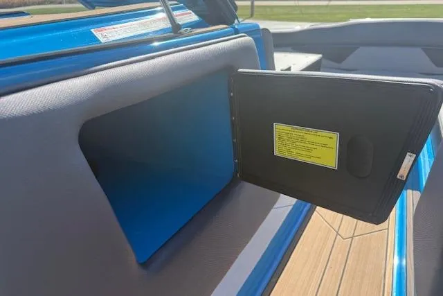 Slide: The Image of 2020 Moomba Makai boat storage compartment with open door, showcasing interior details. - 13