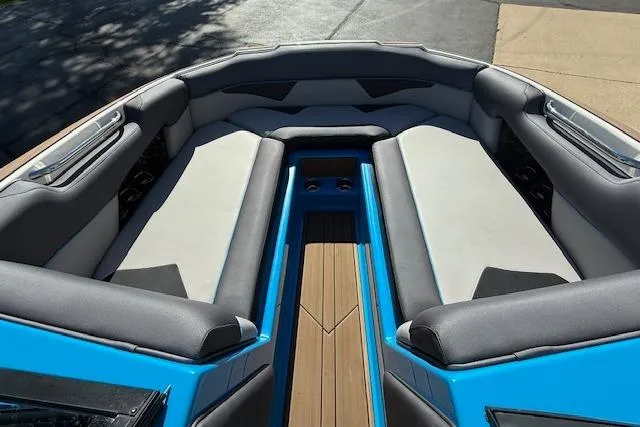Slide: The Image of 2020 Moomba Makai boat interior with blue accents and spacious seating. - 15
