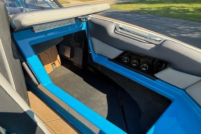 Slide: The Image of 2020 Moomba Makai boat interior with blue accents and seating area. - 18