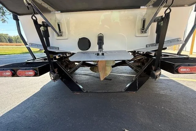 Slide: The Image of Rear view of a 2020 Moomba Makai boat on a trailer, showing propeller and rudder. - 38