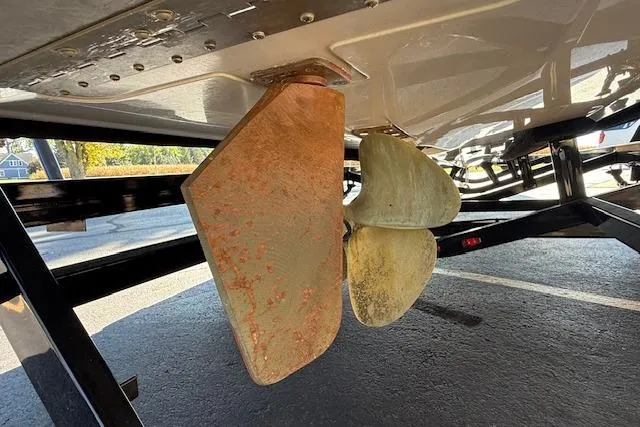 Slide: The Image of 2020 Moomba Makai boat propeller and rudder, showing wear and rust. - 39