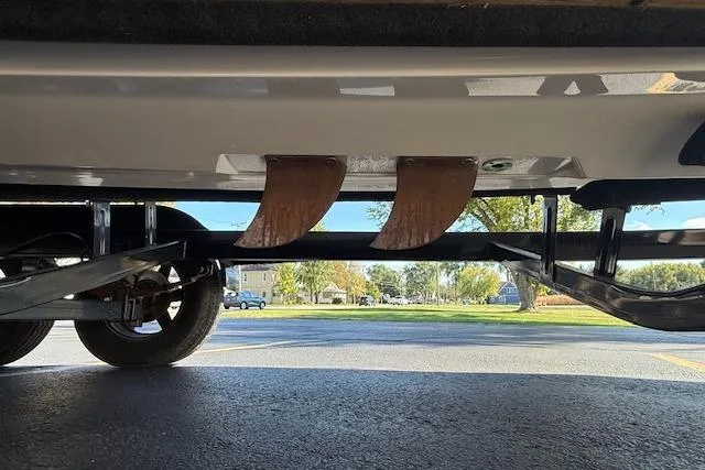 Slide: The Image of 2020 Moomba Makai boat underside with trailer, showcasing fins and suspension system. - 40