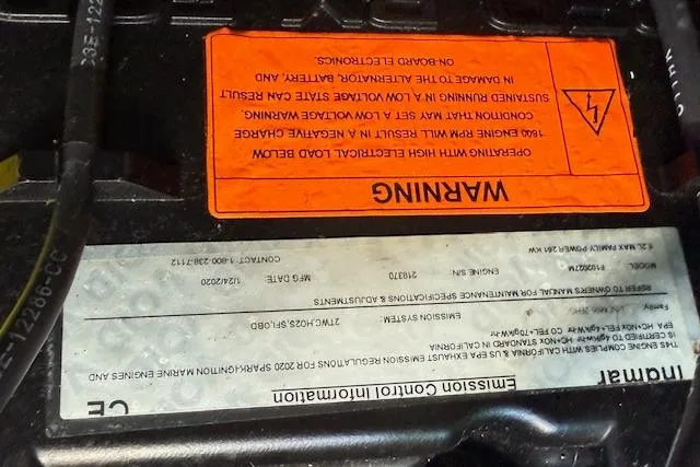 Slide: The Image of 2020 Moomba Makai engine warning labels and emission control information. - 46