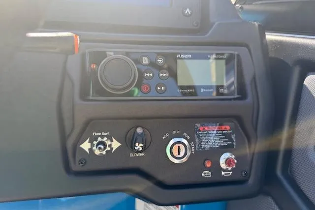 Slide: The Image of Control panel of a 2020 Moomba Makai boat with audio system and switches. - 8