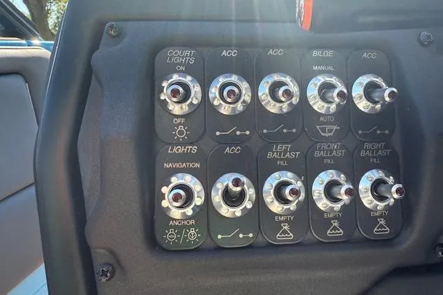 Slide: The Image of Control panel of a 2020 Moomba Makai boat with various switches and labels. - 9