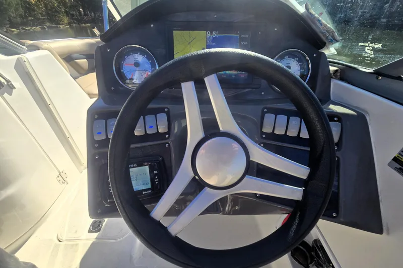 Slide: The Image of Steering wheel and dashboard of 2016 Hurricane SunDeck 2200 DC OB boat. - 10