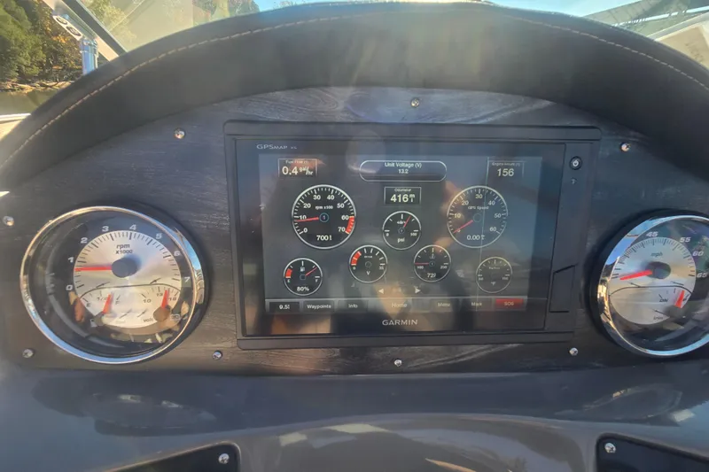 Slide: The Image of Dashboard of a 2016 Hurricane SunDeck 2200 DC OB with Garmin display and gauges. - 11