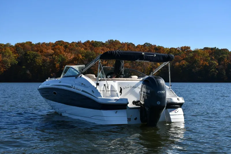 Slide: The Image of 2016 Hurricane SunDeck 2200 DC OB boat on a lake with autumn foliage background. - 3