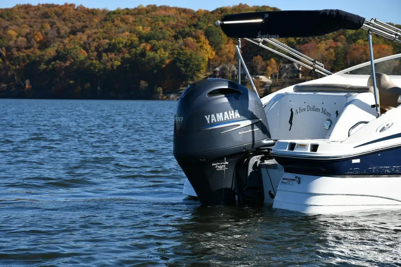 Slide: The Image of 2016 Hurricane SunDeck 2200 DC OB boat with Yamaha engine on a scenic lake. - 4