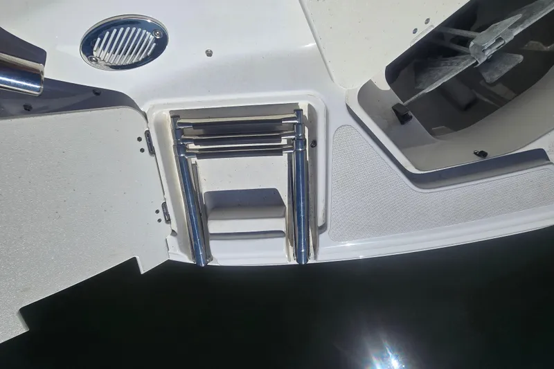 Slide: The Image of 2016 Hurricane SunDeck 2200 DC OB boat ladder and anchor storage area. - 9