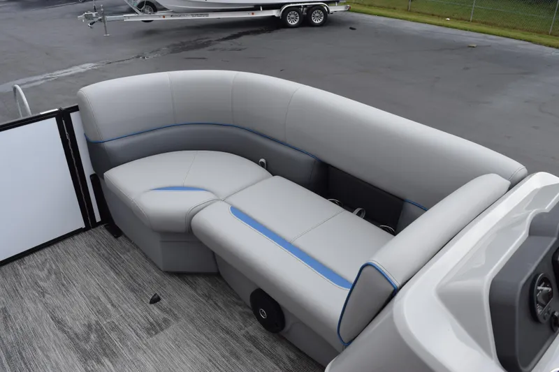 Slide: The Image of 2026 Bentley Pontoons Bolt 223 interior seating with gray upholstery and blue accents. - 11