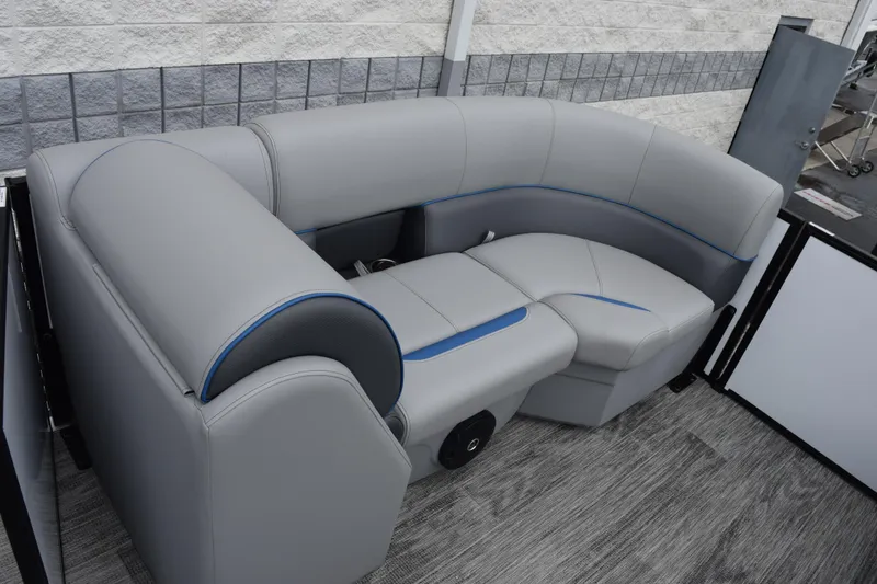 Slide: The Image of 2026 Bentley Pontoons Bolt 223 interior seating with gray upholstery and blue accents. - 12