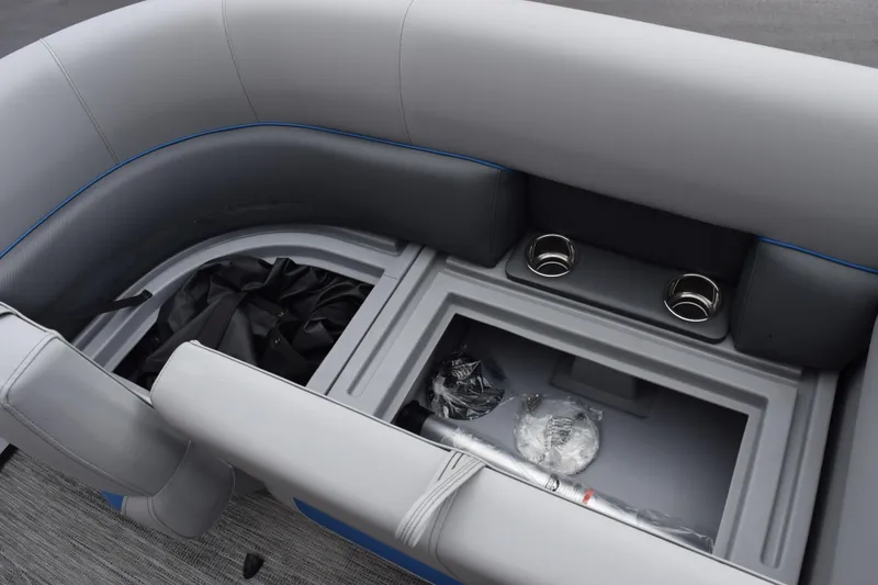 Slide: The Image of 2026 Bentley Pontoons Bolt 223 interior seating with storage and cup holders. - 14
